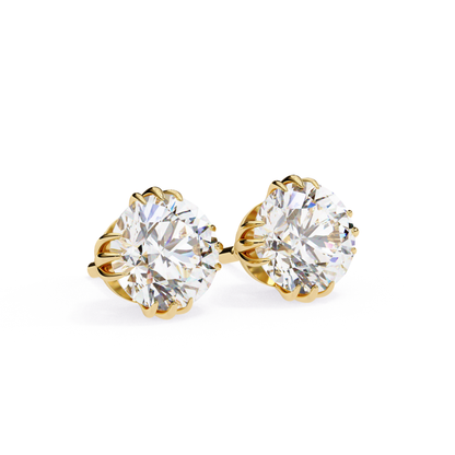 A side view of yellow gold solitaire earrings with brilliant round-cut diamonds, set in a classic prong setting for a refined and luxurious look.