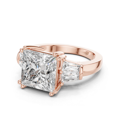 Angled view princess cut diamond engagement ring
Rose gold princess cut baguette diamond ring
Princess cut diamond with tapered baguette sides
Three stone princess cut diamond ring
Four prong princess cut diamond ring
Rose gold diamond ring angled profile
Princess cut ring with baguette side stones
Rose gold three stone diamond ring
Princess cut diamond ring perspective view
Classic princess cut diamond ring in rose gold