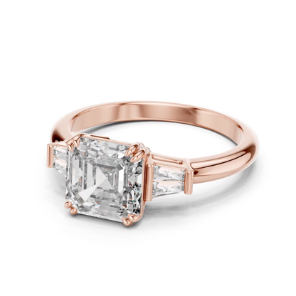 Rose gold Asscher cut diamond ring angled view
Asscher cut diamond ring with tapered side stones
Rose gold three stone diamond ring
Angled view of Asscher cut diamond ring
Rose gold ring with side accent diamonds
Asscher cut diamond ring with polished band
Lab grown Asscher diamond rose gold ring
Rose gold solitaire ring with side stones
Elegant Asscher cut diamond ring in rose gold
Rose gold Asscher diamond engagement ring