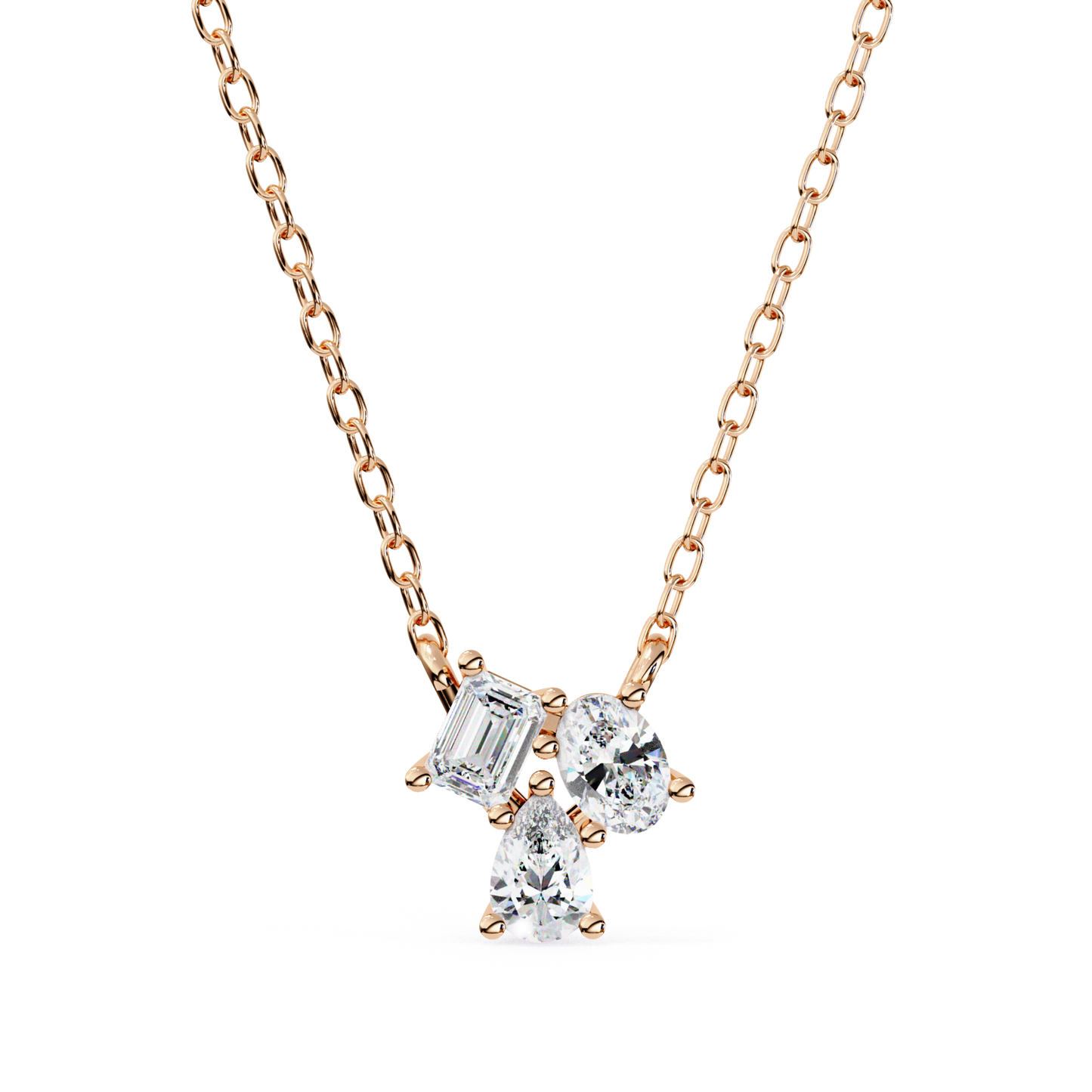 A necklace featuring emerald, oval, and pear-shaped diamonds set in rose gold.