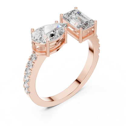 Rose gold toi et moi diamond ring angled view
Angled view of rose gold toi et moi ring
Rose gold emerald cut and pear diamond ring
Pear and emerald cut diamond ring in rose gold
Rose gold two stone diamond engagement ring
Rose gold dual diamond ring angled profile
Toi et moi ring with pear and emerald diamonds
Rose gold bypass ring with two diamonds
Rose gold pear and emerald diamond ring
Rose gold modern toi et moi diamond ring