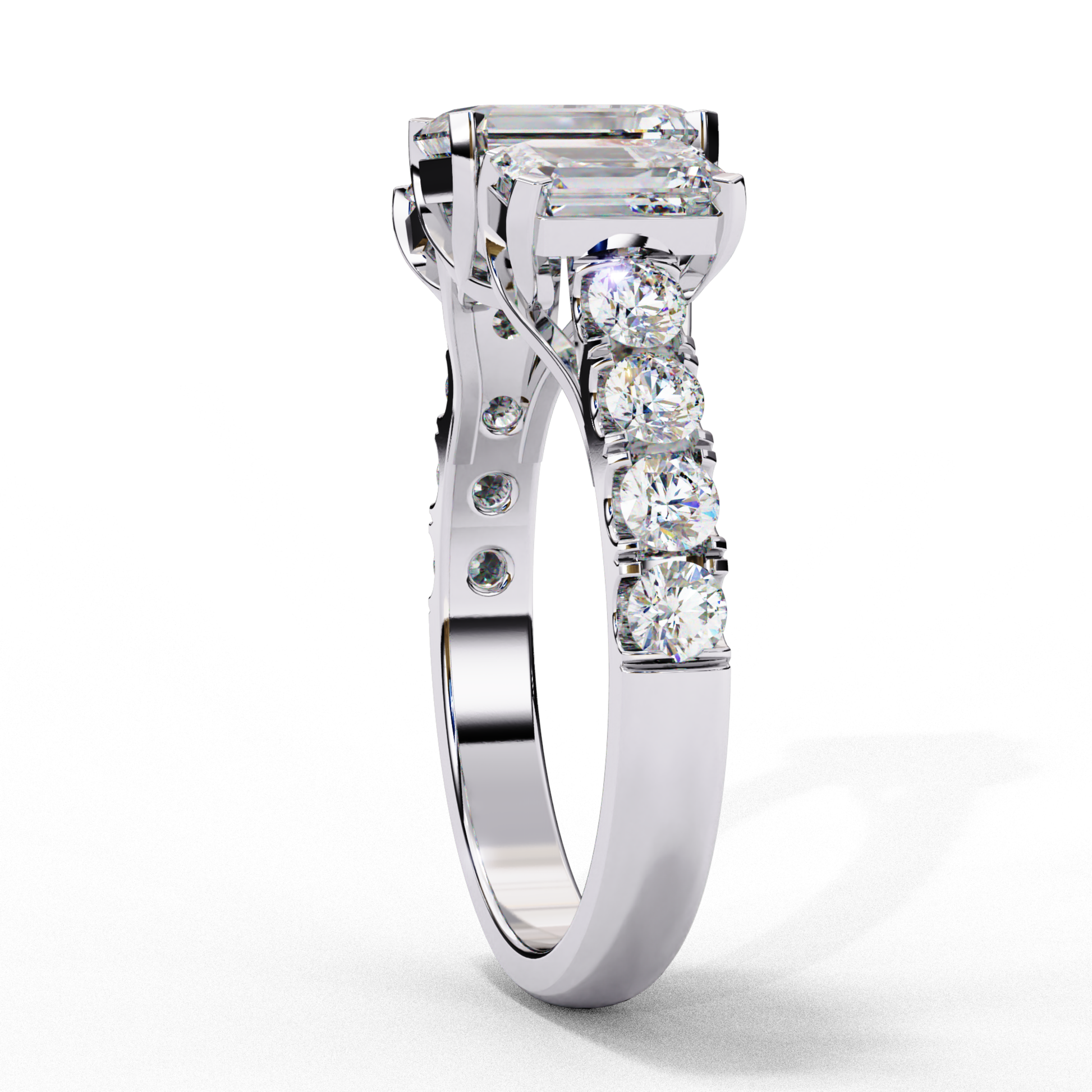 Emerald cut diamond with round side stones
Three stone diamond ring with side diamonds
White gold diamond ring with emerald cut center
Elegant three stone ring with round diamonds
Diamond ring with emerald center stone and side stones
Side view of three stone diamond ring
Three stone diamond ring with white gold band
Emerald cut diamond in a white gold setting
Ring with emerald center and round diamonds
White gold three stone diamond ring