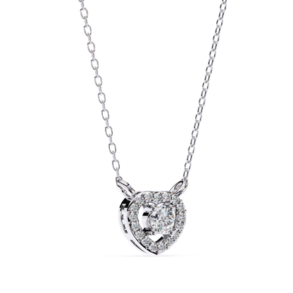 White gold necklace with a delicate chain and a heart pendant set with a round-cut center stone and small accent diamonds.