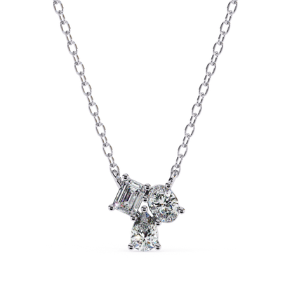 A necklace with emerald, oval, and pear-shaped diamonds set in white gold.