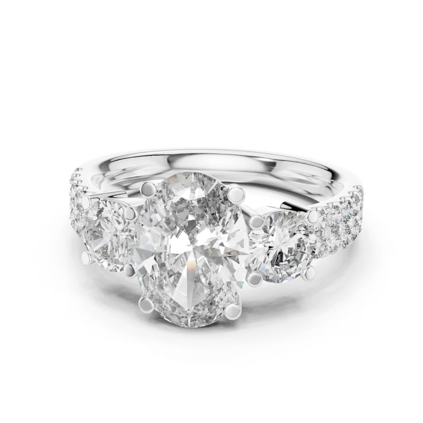 White gold oval three stone diamond engagement ring
Oval cut diamond ring with pave side stones
White gold oval diamond ring with accent diamonds
Three stone oval diamond bridal ring in white gold
Oval lab diamond ring with round side stones
White gold prong set oval diamond ring design
Classic oval diamond engagement ring with pave band
Minimal white gold oval diamond statement ring
Oval center stone ring with diamond accented shank
Elegant white gold oval diamond wedding ring
