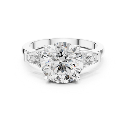 White gold round brilliant three stone ring
Round brilliant diamond ring with trapezoid side stones
White gold three stone engagement ring
Round brilliant diamond ring in white gold
White gold ring with tapered side diamonds
Lab grown round brilliant three stone ring
White gold round center diamond ring
Three stone diamond ring with polished band
Round brilliant diamond ring with side stones
Classic three stone diamond ring
