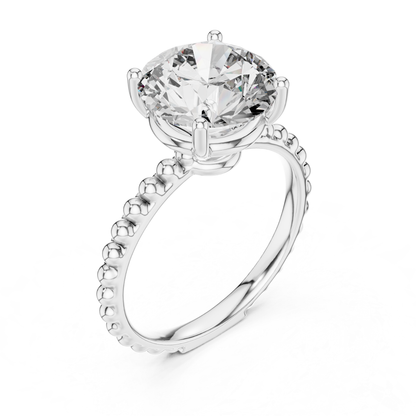 White gold round cut diamond beaded band angled view
White gold solitaire ring with raised diamond setting
Round diamond beaded band engagement ring
Four prong round diamond white gold ring
White gold ring with beaded shank detail
Angled view of round solitaire diamond ring
Polished white gold round diamond ring
Round brilliant diamond ring with beaded band
White gold prong set solitaire ring
Beaded band round diamond white gold engagement ring