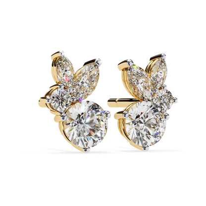Sophisticated yellow gold stud earrings with a round diamond at the center, surrounded by marquise and pear-shaped diamonds, creating a floral-inspired design that shines with elegance.
