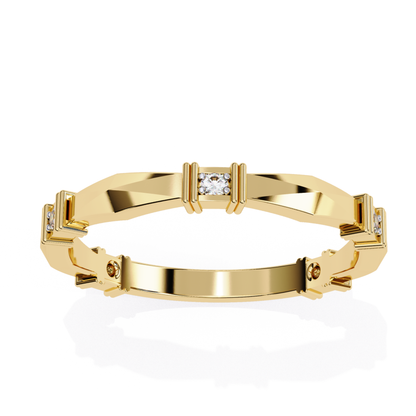 Top-down view of a yellow gold band featuring round and baguette diamonds set in a geometric design.