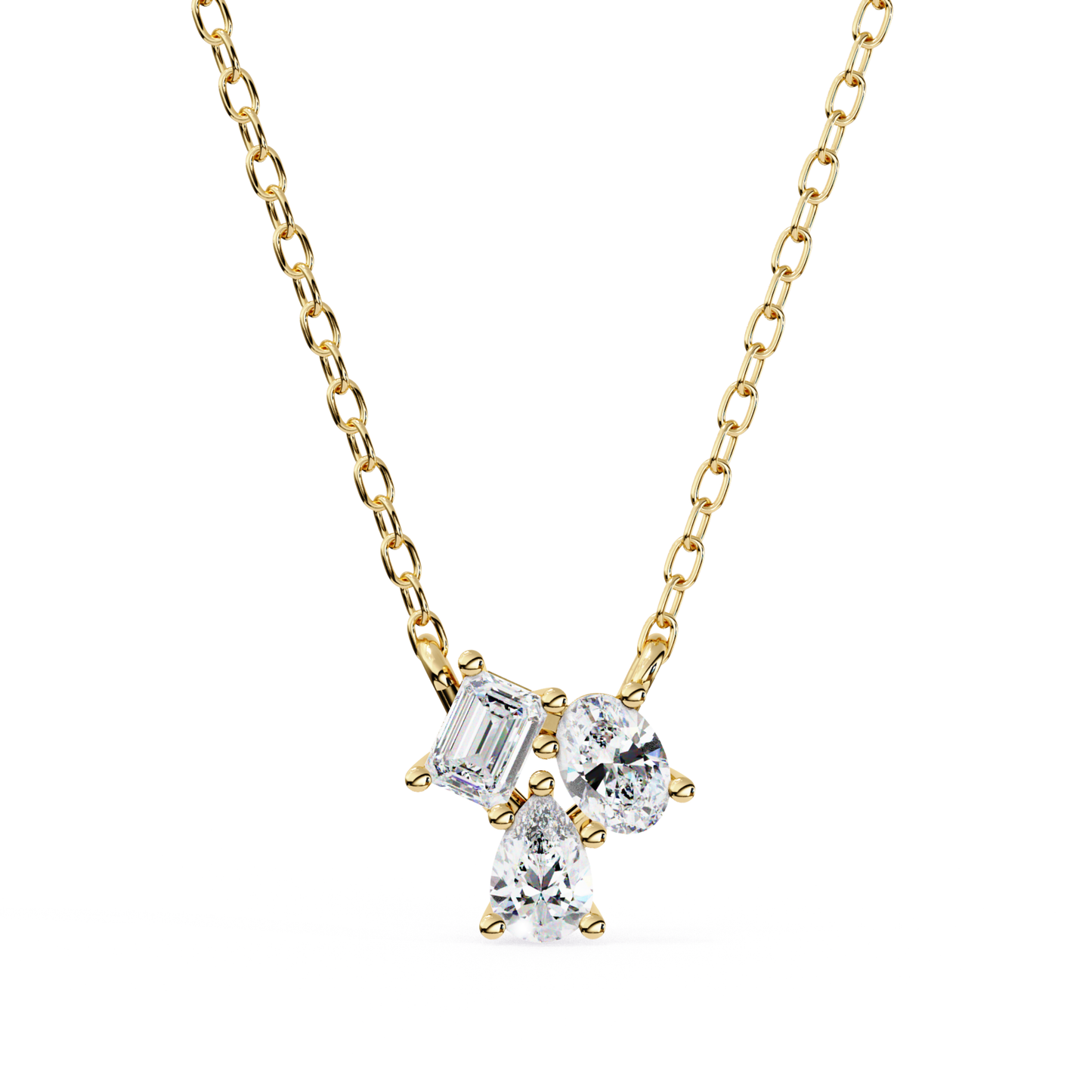 A necklace featuring emerald, oval, and pear-shaped diamonds set in yellow gold.