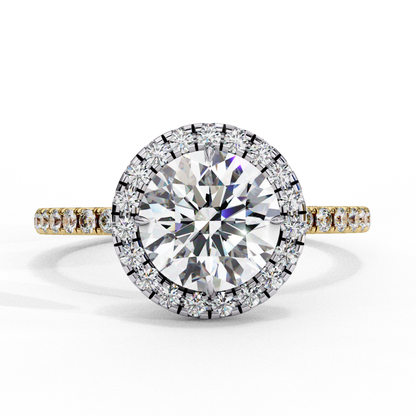 Round diamond surrounded by smaller diamonds
Yellow gold ring with round diamond center
Halo setting with round diamond centerpiece
Side view of round diamond in yellow gold
Gold band with round diamond and small accents
Round diamond surrounded by diamond halo
Yellow gold ring with central round diamond
Close up of round diamond with surrounding stones
Yellow gold band with circular diamond pattern
Round diamond ring with halo in yellow gold