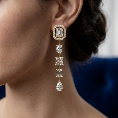 Elegant yellow gold bridal drop earrings with halo and multi-shape diamond design.
