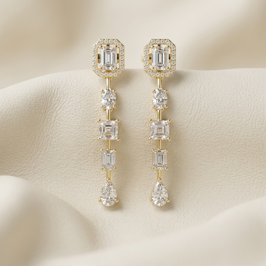Multi shape lab grown diamond drop earrings in yellow gold with emerald halo tops.