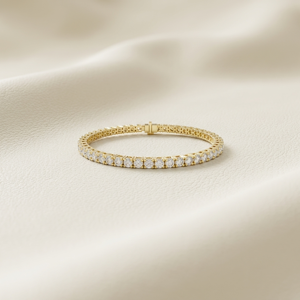 Round lab grown diamond tennis bracelet crafted in yellow gold with brilliant four-prong settings.
