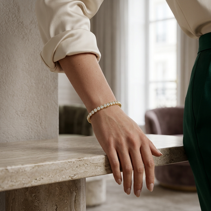 Luxury yellow gold tennis bracelet featuring round brilliant lab grown diamonds.
