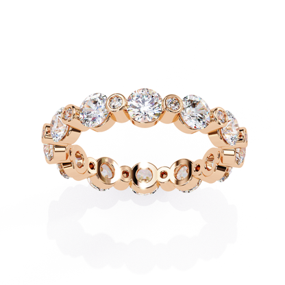 Front view of a rose gold eternity band with round diamonds in bezel settings